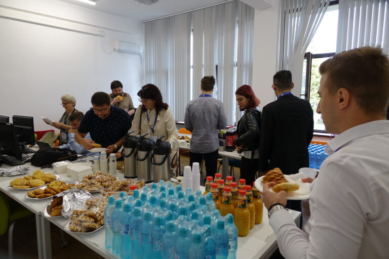 People in the Coffee Break room of RoMedINF 2023