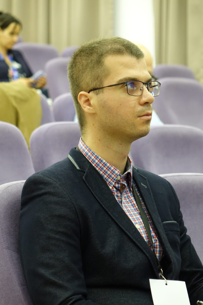 Man listening to the presentation.